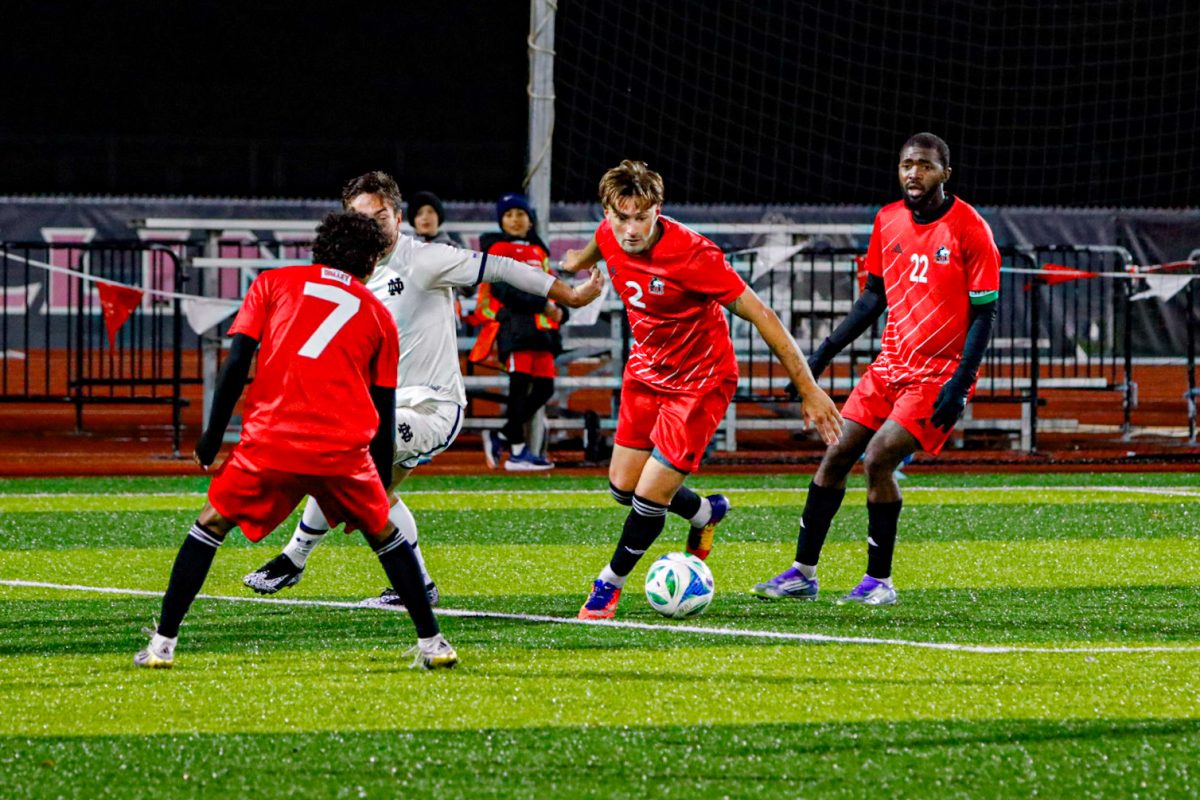 NIU men’s soccer redshirt freshman defender Roman Khela (2) gains possession of the ball against the University of Notre Dame on Tuesday. The Huskies upset the Fighting Irish 2-1, extending their unbeaten streak to six.(Marco Alvarez | Northern Star)