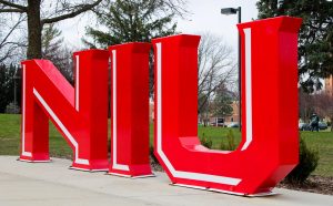 The NIU sign sits on a cloudy day. NIU has been named a 2025 finalist for the Excellence in Student Success Award by the Association of Public and Land-grant Universities. (Northern Star File Photo)
