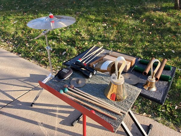 Several instruments rest on a small table at MLK Commons. Since the launch of the Kishwaukee Symphony Orchestra’s Instrument Donation Project in 2024, the DeKalb community has donated 84 instruments to students. (Northern Star File Photo