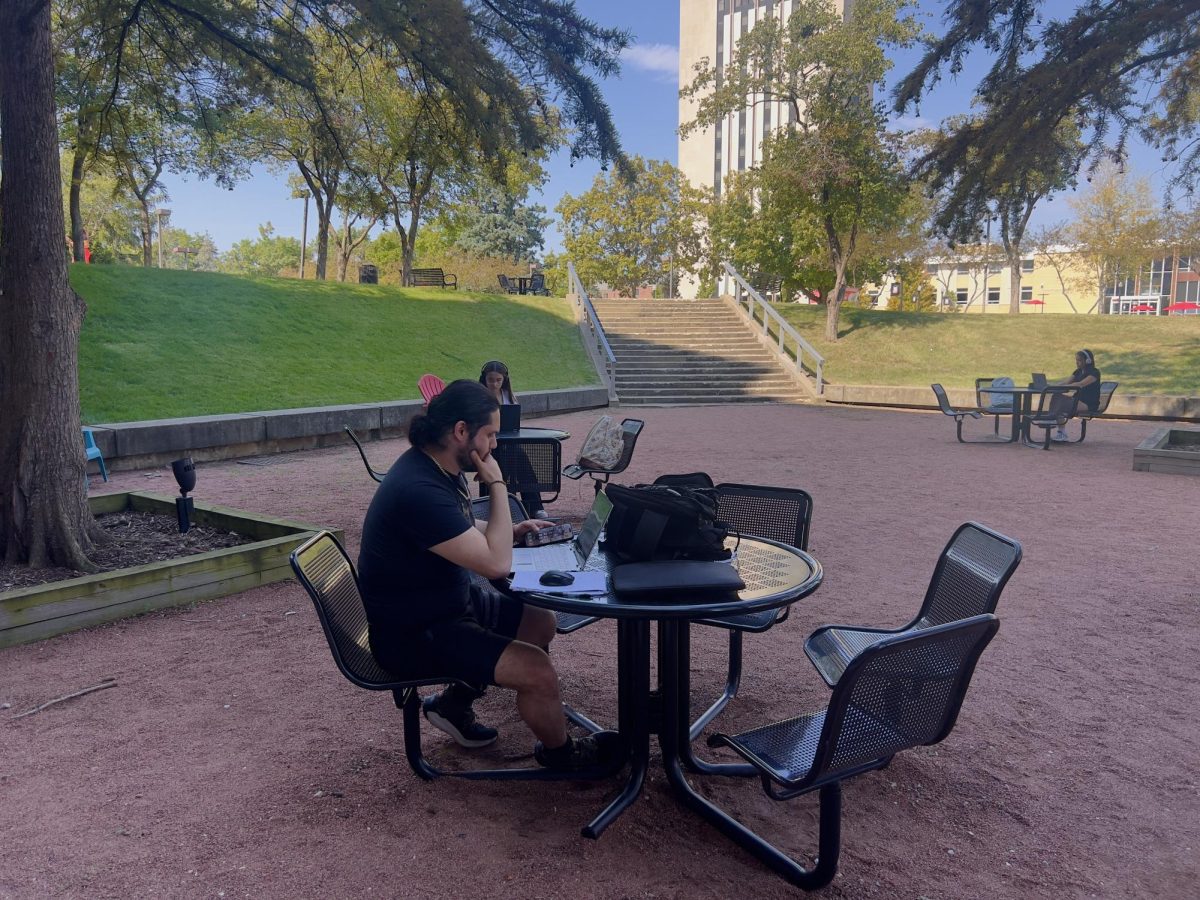 First-year biology major Armin Khamissi studies on Sept. 18 in the courtyard in front of the Founder’s Memorial Library. Assistant Lifestyle Editor Johnathan Shelby shares  studying tips from the Huskie Academic Success Center. (Sofia Howell | Northern Star)