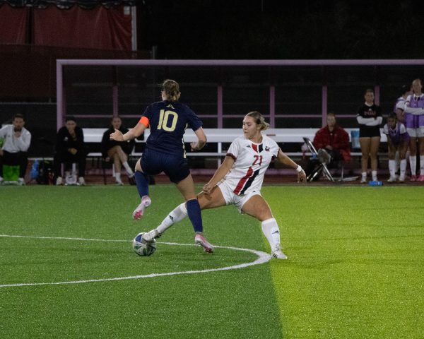 NIU women’s soccer sophomore midfielder Lauren Mrugala (21) reaches for the ball in the Huskies’s match against the University of Akron on Sept. 25. NIU earned its first Mid-American Conference win in a 1-0 victory over Central Michigan University on Thursday. (Alexia Beck | Northern Star)