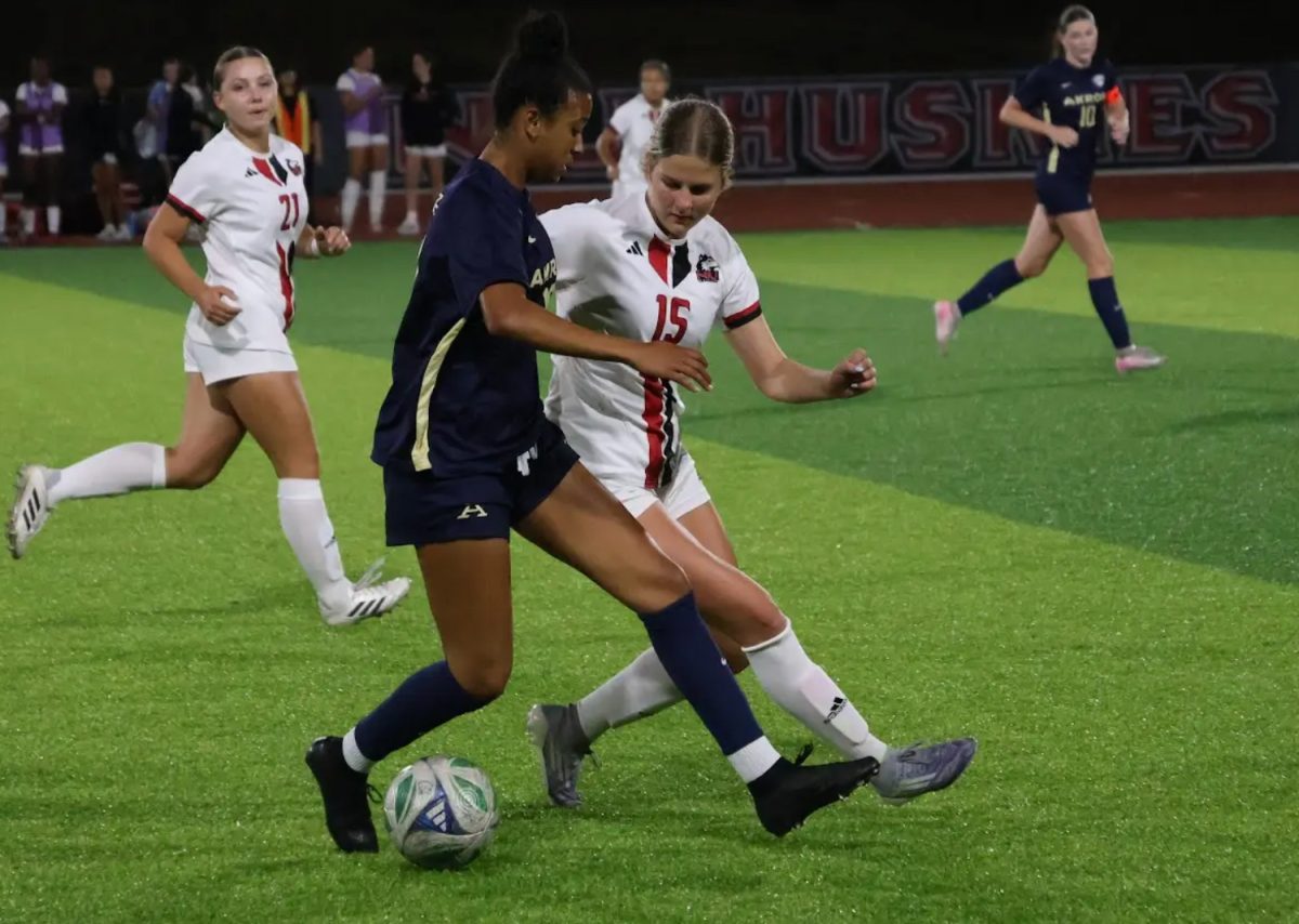 NIU women’s soccer freshman defender Elle Wainscott (15) battles for the ball during the Huskies’ match against the University of Akron on Sept. 25. Wainscott recorded the only shot of the second half for NIU in a 1-0 loss to Kent State University on Sunday.  (Alexia Beck | Northern Star)