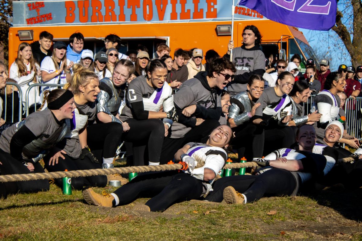 Members of Sigma Sigma Sigma and their coaches cheer on the Sigma Sigma Sigma tuggers on Saturday during the 2025 Women’s Tugs Championship. Sigma Sigma Sigma won the first rope after reaching the time limit. (Ethan Rodriguez | Northern Star)