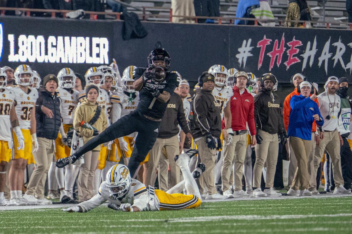 NIU football sophomore wide receiver Gary Givens (7) is interfered with while trying to complete a catch during the fourth quarter of the Huskies’ game against Western Michigan University on Tuesday. The Northern Star Sports staff shares their predictions for the outcomes of five college football games scheduled to take place this week. (Totus Tuus Keely | Northern Star)