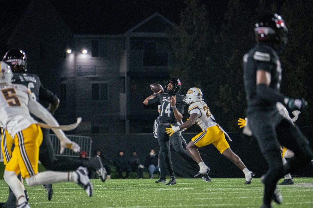 NIU football redshirt junior Jalen Macon (14) looks for an open receiver during the first quarter of the Huskies’ game against Western Michigan University on Tuesday.  Sports Reporter Logan Whittington shares his greatest takeaways from NIU’s 35-19 loss. (Totus Tuus Keely | Northern Star)