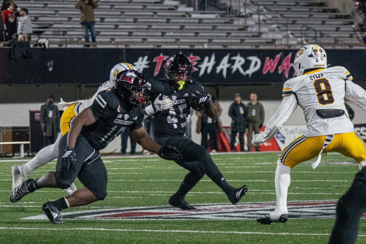 NIU sophomore running back Telly Johnson Jr. (45) rushes for a 4-yard loss during the first quarter of a football game against Western Michigan University on Nov. 18 at Huskie Stadium in DeKalb. On Friday, NIU will host Kent State University, who seeks its fourth Mid-American Conference victory this season. (Northern Star file photo)