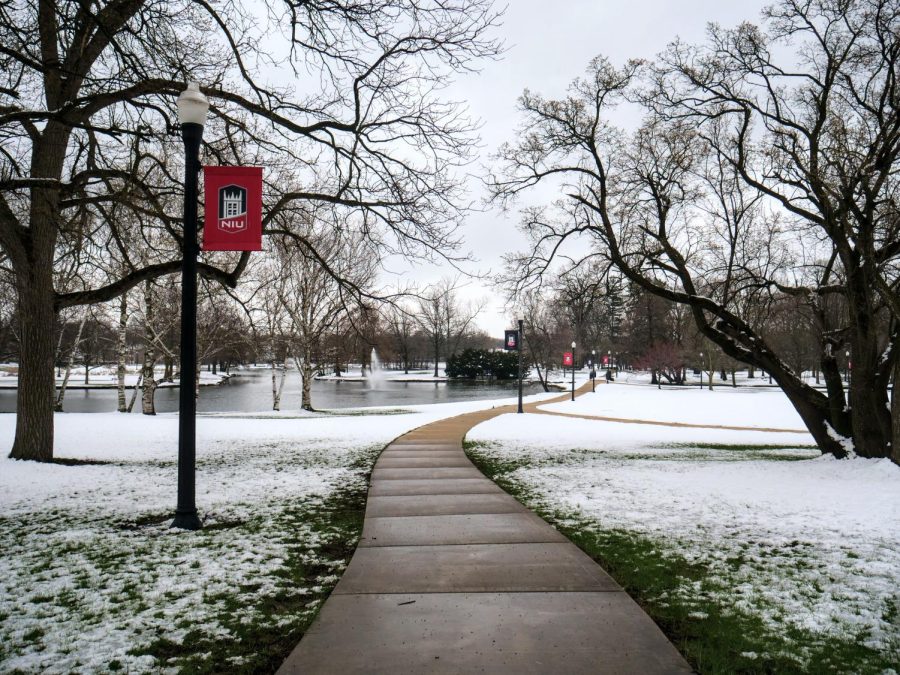 Snow rests near a path by the East Lagoon. NIU will host winter-themed events throughout the week, including the President’s Holiday Gathering from 2:30 p.m to 4:30 p.m. Tuesday in the Altgeld Hall Auditorium. (Northern Star File Photo)