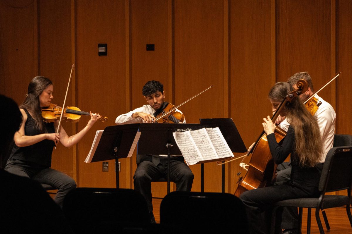 The Dákiti String Quartet performs “String Quartet no. 7 in F minor, Op.108” by Dmitri Shostakovich on Nov. 24 in the Recital Hall in the Music Building. The Dákiti String Quartet is a graduate quartet at NIU. (Grace Kilbreath | Northern Star)