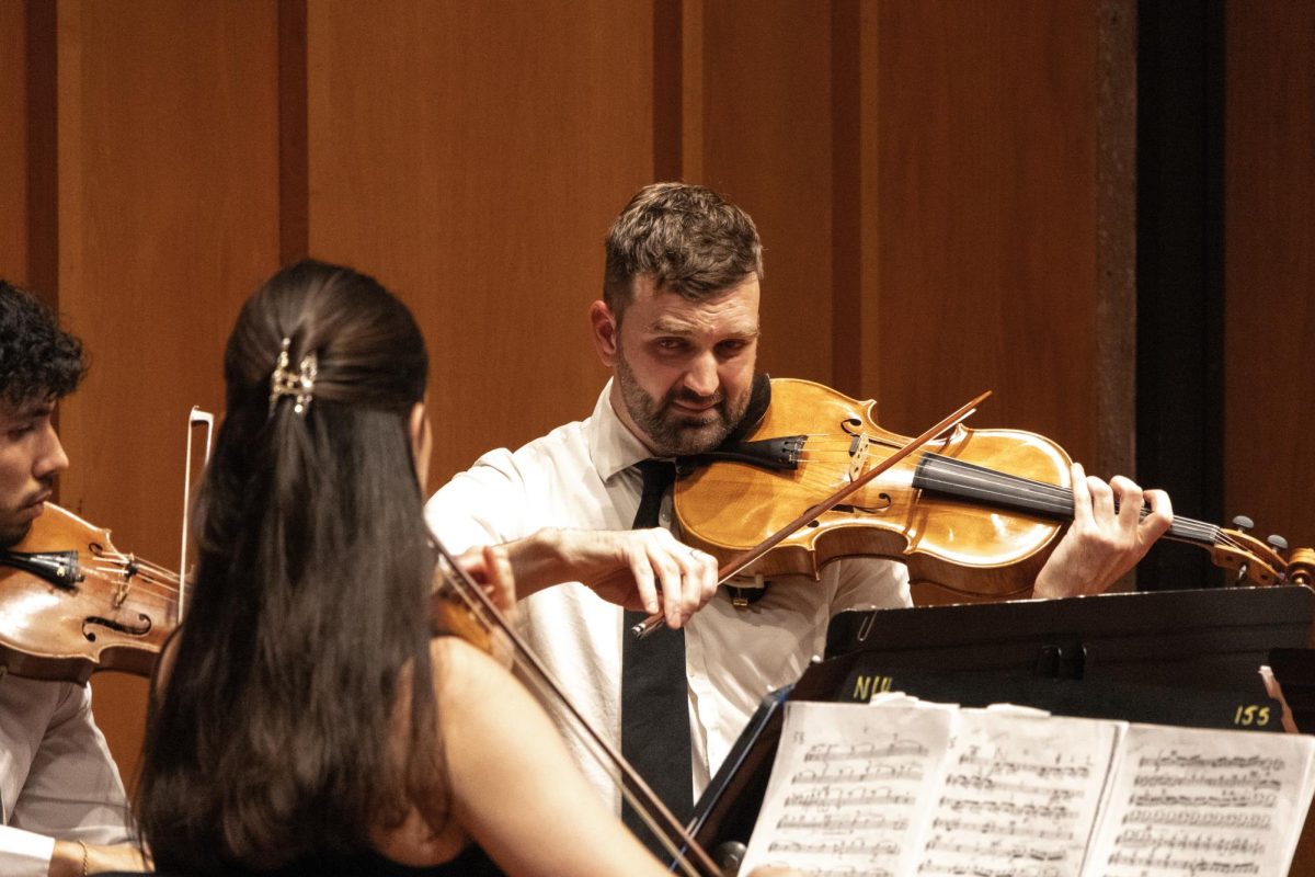 Jacob Seabrook glances at the other members of the Dákiti String Quartet while “Razumovsky Op. 59, No.3” by Ludwig Von Beethoven using a viola on Nov. 24 in the Recital Hall in the Music Building.“Razumovsky Op. 59, No.3” was composed by Beethoven in 1806 and contains four movements. (Grace Kilbreath | Northern Star)