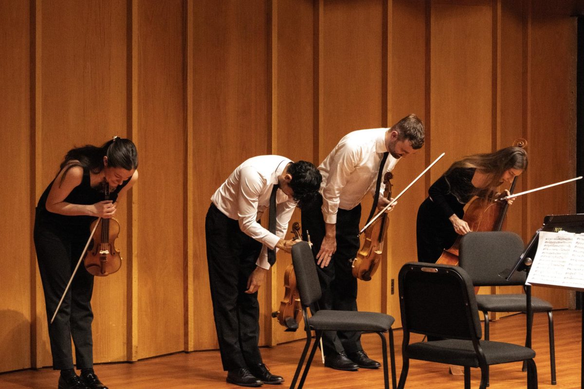 The Dákiti String Quartet bows before the audience after concluding the performance on Nov. 24 in the Recital Hall in the Music Building. The Dákiti String Quartet’s next performance will be on Wednesday at 7 p.m. in the Recital Hall in the Music Building. (Grace Kilbreath | Northern Star)