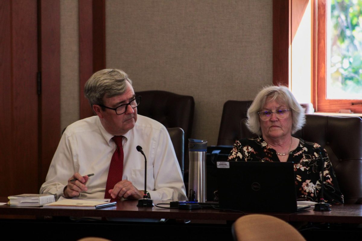 University Advisory Committee member Brad Cripe (left) and Administrative Assistant Pat Erickson sit at the University Council meeting on Sept. 10. The University Council outlined its third Strategic Enrollment Management plan at its meeting Wednesday in Altgeld Hall, Room 315. (Ethan Rodriguez | Northern Star)
