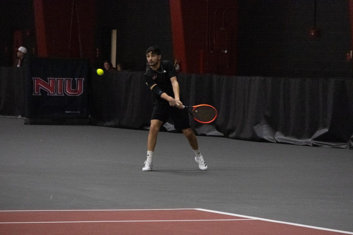 NIU men’s tennis sophomore Lorenzo Leti Messina prepares to return the ball during his singles match against Xavier University. NIU earned its first loss of the season in a 4-3 loss to the Musketeers on Saturday. (Sanaa Scott | Northern Star)