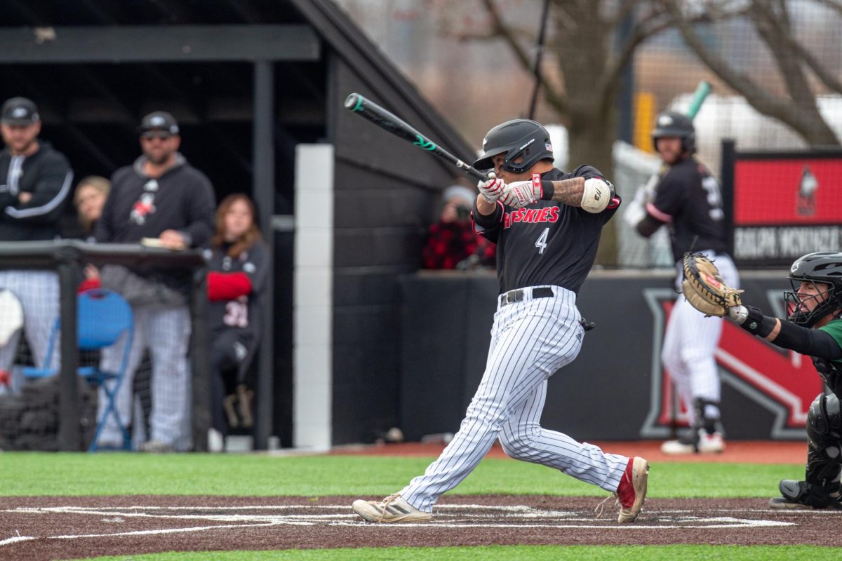 NIU baseball then-sophomore catcher Cooper Cohn swings at a pitch during the Huskies’ game against Ohio University on April 5. NIU released its 2026 schedule on Friday. (Northern Star file photo)