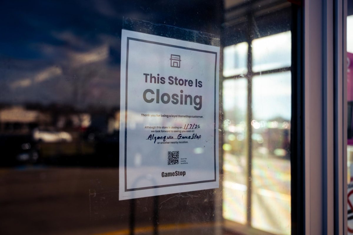 A sign reading “This Store Is Closing” is posted on Tuesday at the front door of Gamestop, 2564 Sycamore Road. The DeKalb location joined GameStops across the country in closing its doors permanently on Jan. 7. (Totus Tuus Keely | Northern Star)
