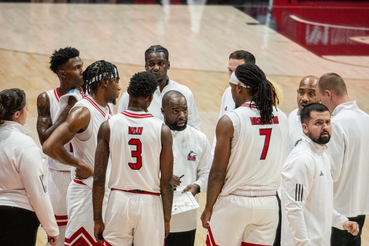 NIU men’s basketball head coach Rashon Burno leads a timeout during the Huskies’ exhibition game against Quincy University on Oct. 28. NIU extended its losing streak to four games with a 77-59 loss to Eastern Michigan University on Tuesday. (Totus Tuus Keely | Northern Star)