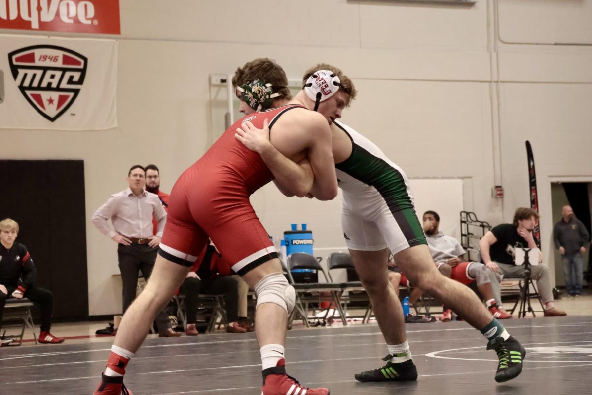NIU wrestling redshirt sophomore Brett Smith grapples with Ohio University redshirt junior Jack Lledo in the 165-pound duel on Friday. NIU’s next match is at 1 p.m. on Friday at Lock Haven University. (Sofia Howell | Northern Star)