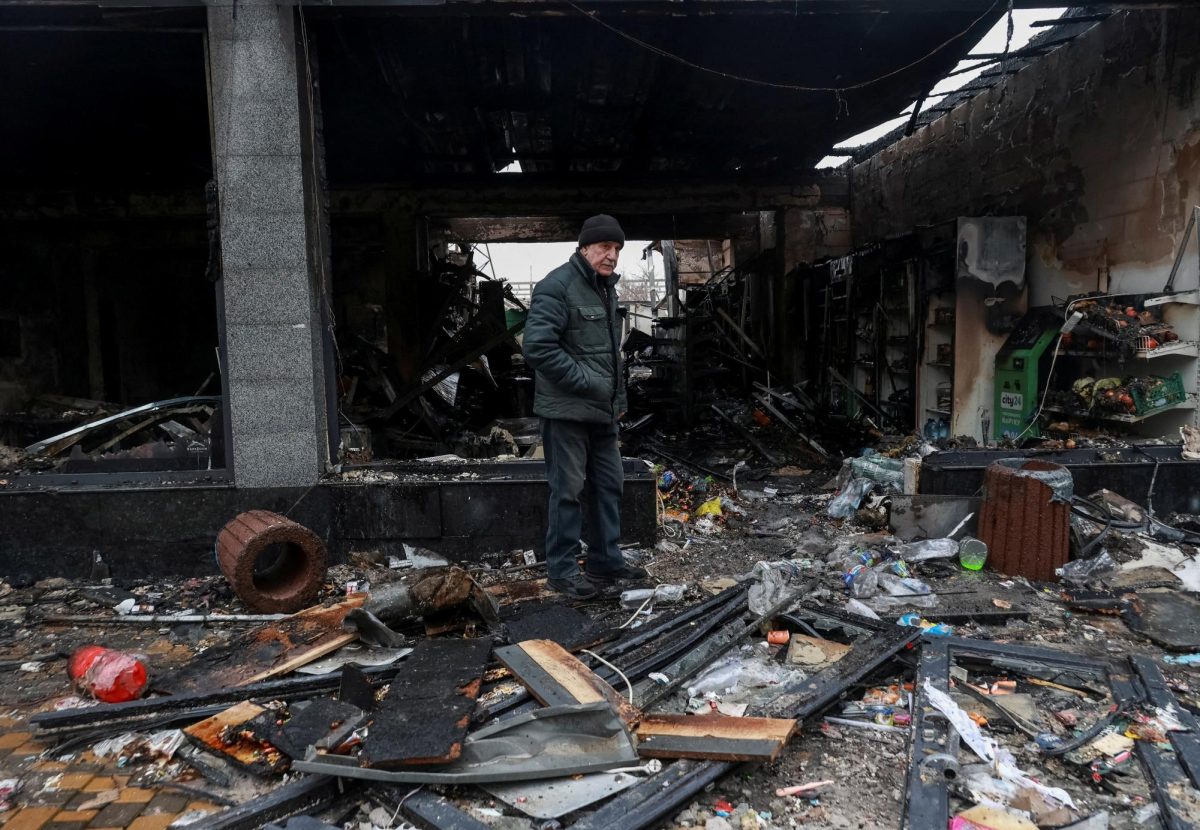 On Tuesday in Odesa, Ukraine, a resident stands at the site of a Russian drone strike. Opinion Columnist Santiago Montañez Bertoletti believes, without intervention from allies, Ukraine may risk annihilation in Russia's war of attrition, however Russia is not doing much better. (REUTERS | Nina Liashonok)