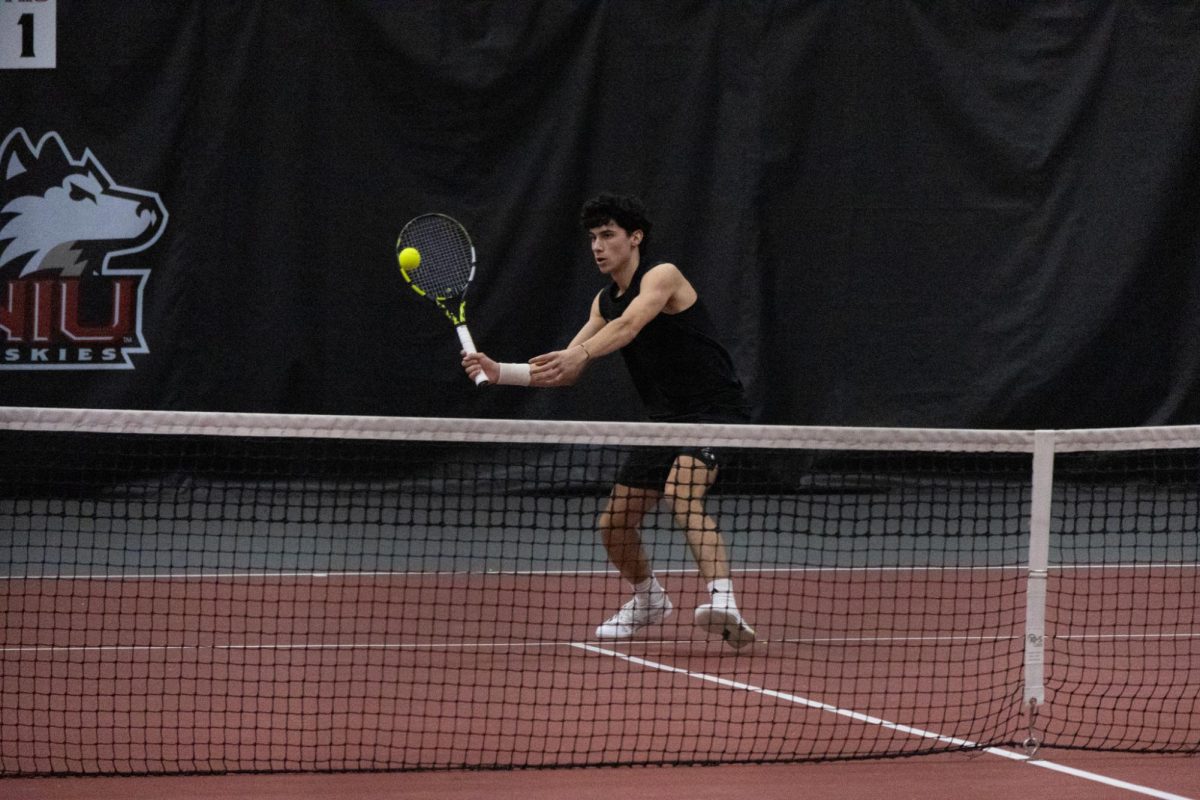 NIU men’s tennis senior Iker Gaztambide Arrastia hits the ball in his singles match against Xavier University junior Nick Herdoiza on Saturday in the Chick Evans Field House. Gaztambide Arrastia defeated his opponent in both sets 6-4 and 6-2. (Sanaa Scott | Northern Star)