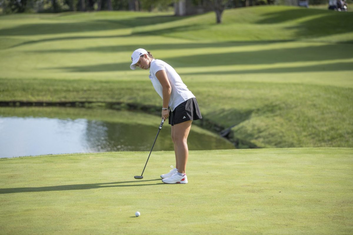NIU women’s golf sophomore Alexa Ouellet follows through a shot during practice at Rich Harvest Farms. The Huskies took second place in a field of five teams at the GCU Invitational on Wednesday. (Courtesy of NIU Athletics)
