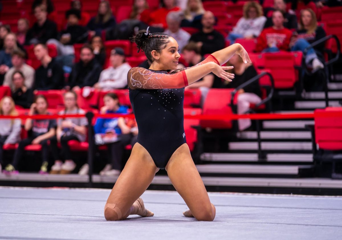 NIU women’s gymnastics junior Dawsyn Sallee poses during her floor routine during the Beauty and the Beast meet Friday inside the Convocation Center. The Huskies’ next meet will be at 6 p.m. Monday at Illinois State University. (Eric McGill | Northern Star)
