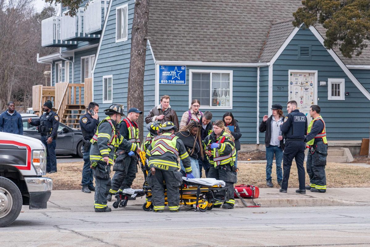 DeKalb Fire Department tend aid to an individual who was struck by a vehicle. Around 11 a.m., a pedestrian crossing Lucinda Avenue near Carroll Avenue was struck by a vehicle. (Totus Tuus Keely | Northern Star)