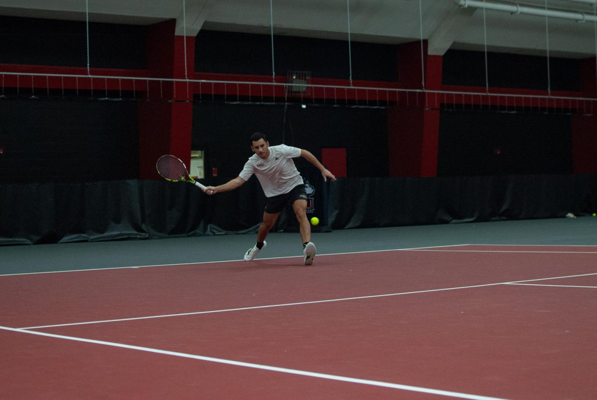 NIU men’s tennis senior Iker Dellien Velasco runs to the ball during his match at No. 3 singles against the University of Wisconsin-Whitewater on Sunday. NIU took a 4-2 win over the University of Nebraska at Omaha and a 6-1 win against Whitewater, improving to 6-1 on the season. (Aidan Penca | Northern Star)