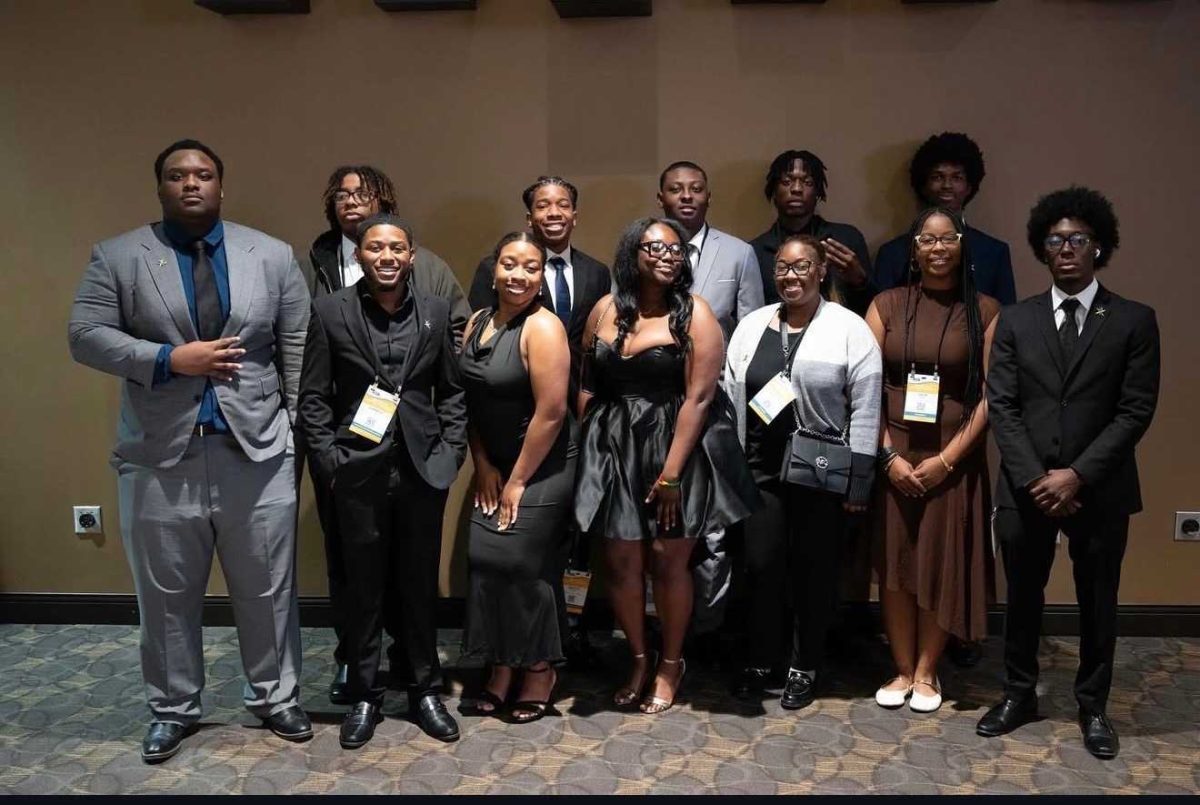Members and executive board members of the National Society of Black Engineers pose for a photo during the NSBE Region 4 Fall Regional Conference in November in Covington, Kentucky. NBSE provides mentorship, professional development and community to engineering students. (Courtesy of the National Society of Black Engineers)