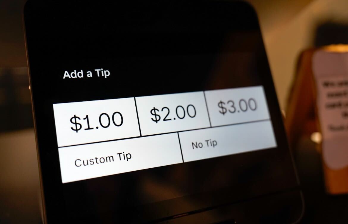 The tip screen is displayed on a Cast Iron Coffee kiosk at 901 Lucinda Ave., Suite D. Opinion Columnist Adrian Maurer believes people should not feel obligated to leave a tip. (Ty McWilliams | Northern Star)