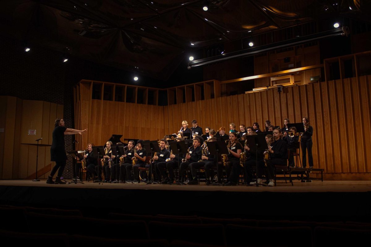 Cara Collins, director for the Monona Grove High School Jazz Ensemble II, conducts the band to decrescendo during a section of “La Noche Del Burrito Picante” by Mike Dana during Jazz Day on Feb. 6 in the Music Building, Boutell Memorial Concert Hall. High schools will visit NIU again to perform during Jazz Day from 8 a.m. to 5 p.m. Thursday in the Boutell Memorial Concert Hall. (Northern Star File Photo)