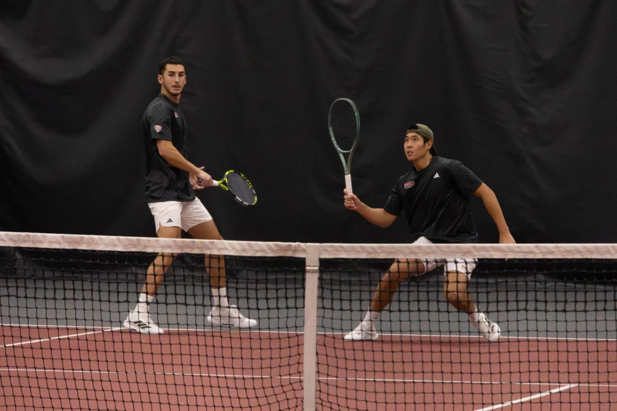 
NIU men’s tennis senior Iker Dellien Velasco (left) and sophomore Chiao Bo Suo Nan track the ball in the Huskies’ match against Southern University and A&M College on Friday in the Chick Evans Field House. The Huskies swept Southern in a 7-0 win on Friday. (Sanaa Scott | Northern Star)
