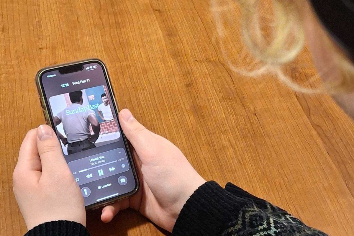 The album cover of "Sunday's Best" by Nick Jonas is displayed on a phone screen. "Sunday's Best” is Jonas’ first solo album in five years and focuses on themes of fatherhood, marriage and his Type 1 diabetes journey. (Sanaa Scott | Northern Star)