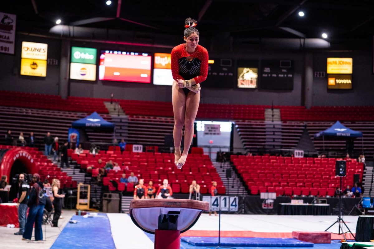 NIU women’s gymnastics junior Dawsyn Sallee rotates during her vault attempt against the University of Wisconsin-La Crosse on Feb. 1. Sallee took the vault title as the Huskies fell to Bowling Green State University on Sunday. (Northern Star file photo)
