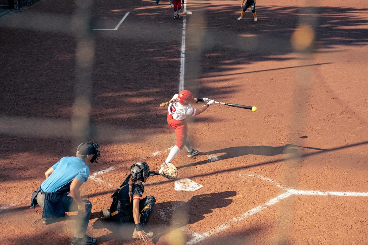 NIU softball sophomore utility player Mia Morera (2) swings at a pitch during NIU’s game against Triton College on Sep. 12. NIU lost to the University of Kentucky and Indiana State University in a doubleheader on Friday. (Totus Tuus Keely | Northern Star)