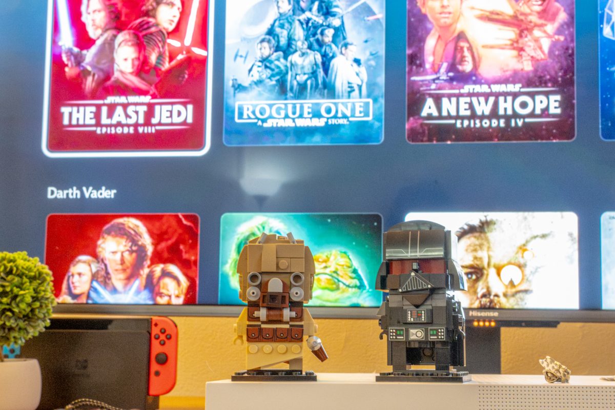 Lego Darth Vader and Tusken Raider models from “Star Wars” sit in front of the Disney+ “Star Wars" collections screen. Opinion Columnist Santiago Montañez Bertoletti believes Dave Filone is returning “Star Wars” to its original story after Kathleen Kennedy steered it away from the original saga. (Totus Tuus Keely | Northern Star)