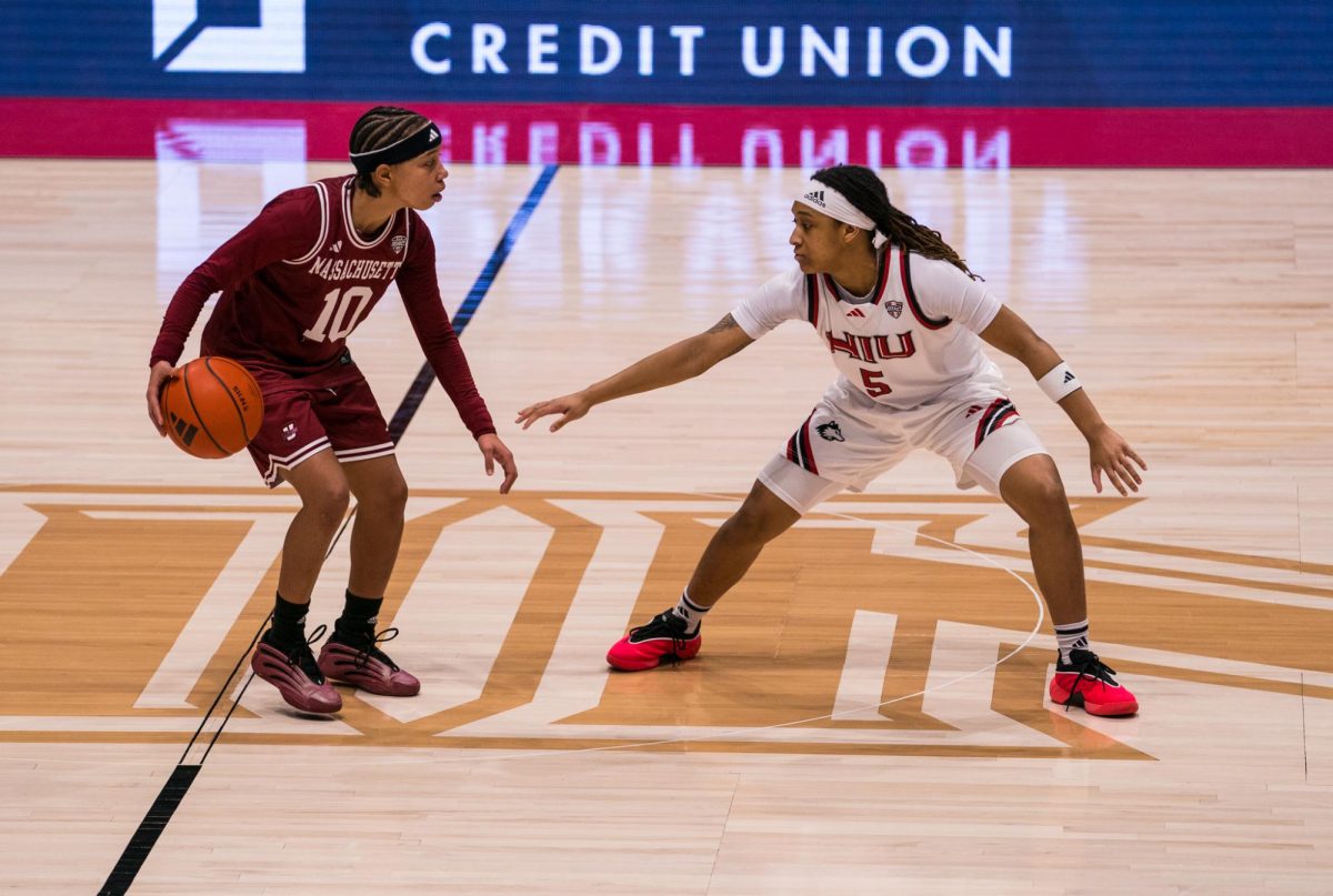 NIU women’s basketball redshirt freshman guard Sa’Mahn Johnson (5) defends University of Massachusetts Amherst sophomore guard Yahmani McKayle (10) during Tuesday’s game in the Convocation Center. The Huskies lost the game 75-54, moving to 5-19 overall and 2-10 in Mid-American Conference play. (Eric McGill | Northern Star)