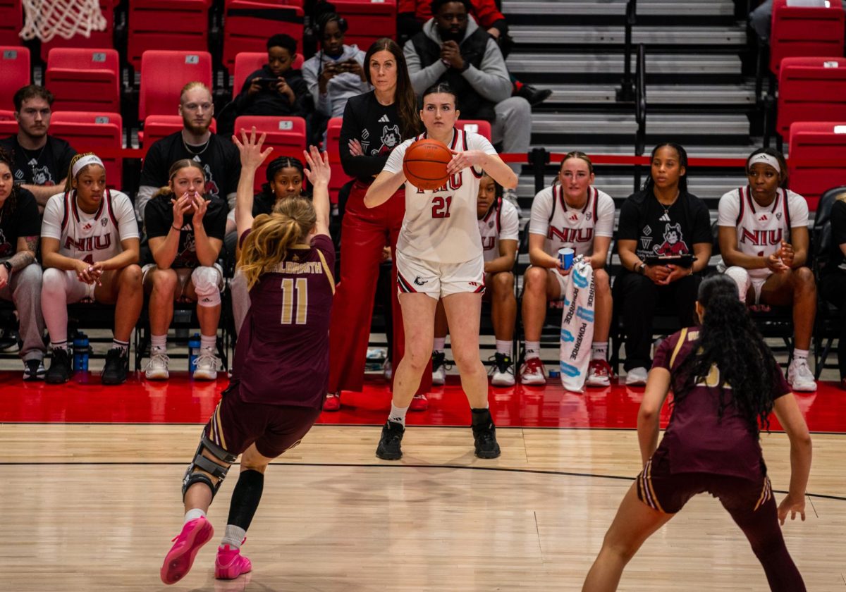 NIU women’s basketball senior forward Marta Hermoso (21) takes a three-point shot during NIU’s game against Texas State University on Saturday. Hermoso scored a career-high 13 points in the Huskies’ 75-54 loss to the University of Massachusetts on Tuesday. (Eric McGill | Northern Star)