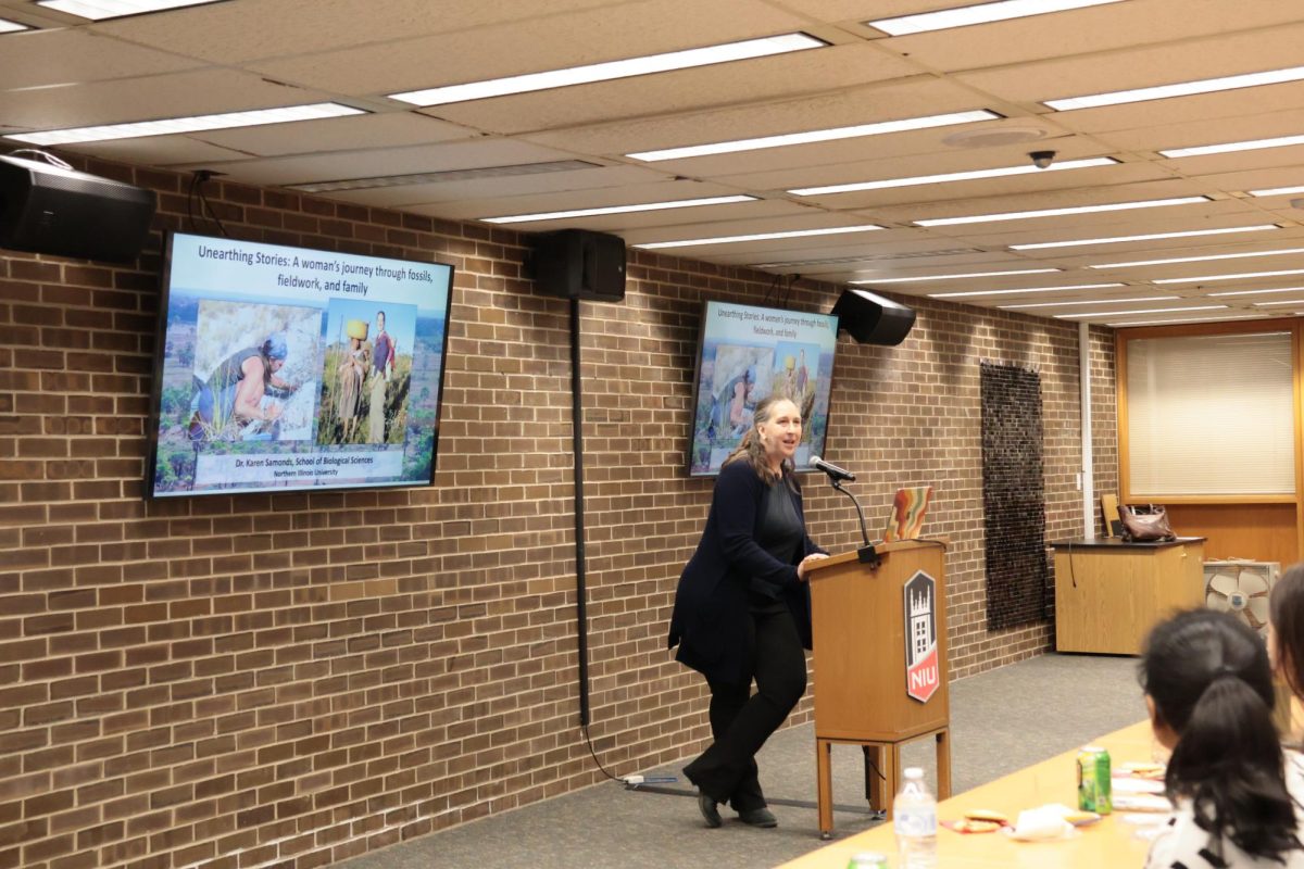 Karen Samonds, professor of biological sciences, presents for the Women In Stem Spring Lecture Series on Tuesday in the Staff Lounge of the Founders Memorial Library. Karen Samonds discussed how her research in paleontology and comparative anatomy intersects with her personal experiences navigating a career in science and family life. (Anfal Mekki | Northern Star)