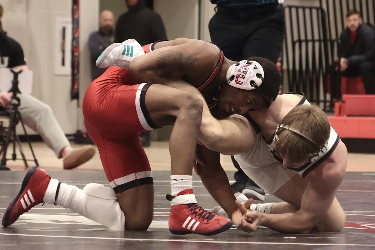 NIU wrestling redshirt junior Markel Baker traps Ohio University junior Ryan Meek on the mat in the 133-pound match on Jan. 23. Baker won his bout against the University at Buffalo as the Huskies took a 29-11 victory over the Bulls on Friday. (Northern Star file photo)