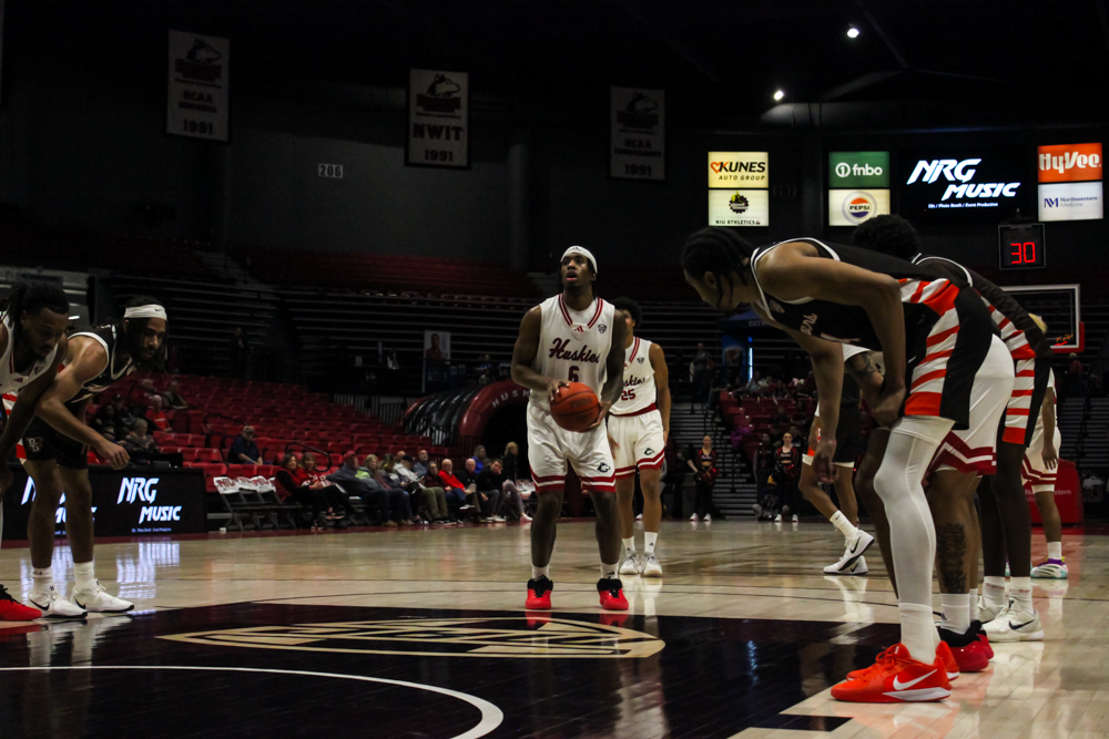 NIU men's basketball freshman guard Taj Walters (6) prepares for a free-throw attempt as players from both teams line up along the lane. NIU dropped an 88-46 game to Central Michigan University on Saturday, the Huskies’ worst loss of the season. (Logan Reed | Northern Star)