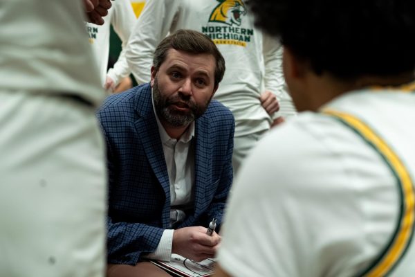 Then-Northern Michigan University head coach Matt Majkrzak talks to his team during a timeout in a Great Lakes Intercollegiate Athletic Conference basketball game against Purdue University Northwest on Jan. 22 at Vandament Arena in Marquette, Michigan. Majkrzak was named NIU's 30th men's basketball head coach on Tuesday after seven seasons leading the Wildcats. (Courtesy of Northern Michigan Athletics)