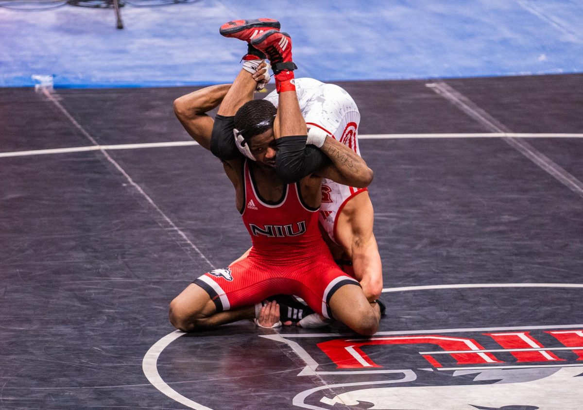 
NIU wrestling redshirt junior Markel Baker takes on Southern Illinois University Edwardsville redshirt junior Marcel Lopez during the Beauty and the Beast meet on Feb. 20. Baker won the Mid-American Conference title at 133 pounds at the MAC Championship on Saturday. (Northern Star file photo)