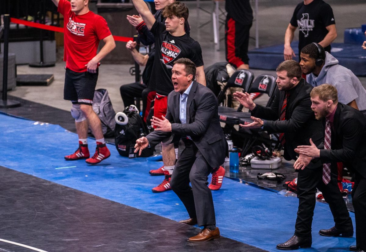 NIU wrestling head coach Ryan Ludwig cheers on the Huskies during the Beauty and the Beast meet on Feb. 20  inside the Convocation Center. Sports Reporter Eric Avila shares his greatest takeaways from the wrestling season as the Huskies prepare for the Mid-American Conference championships. (Northern Star file photo)
