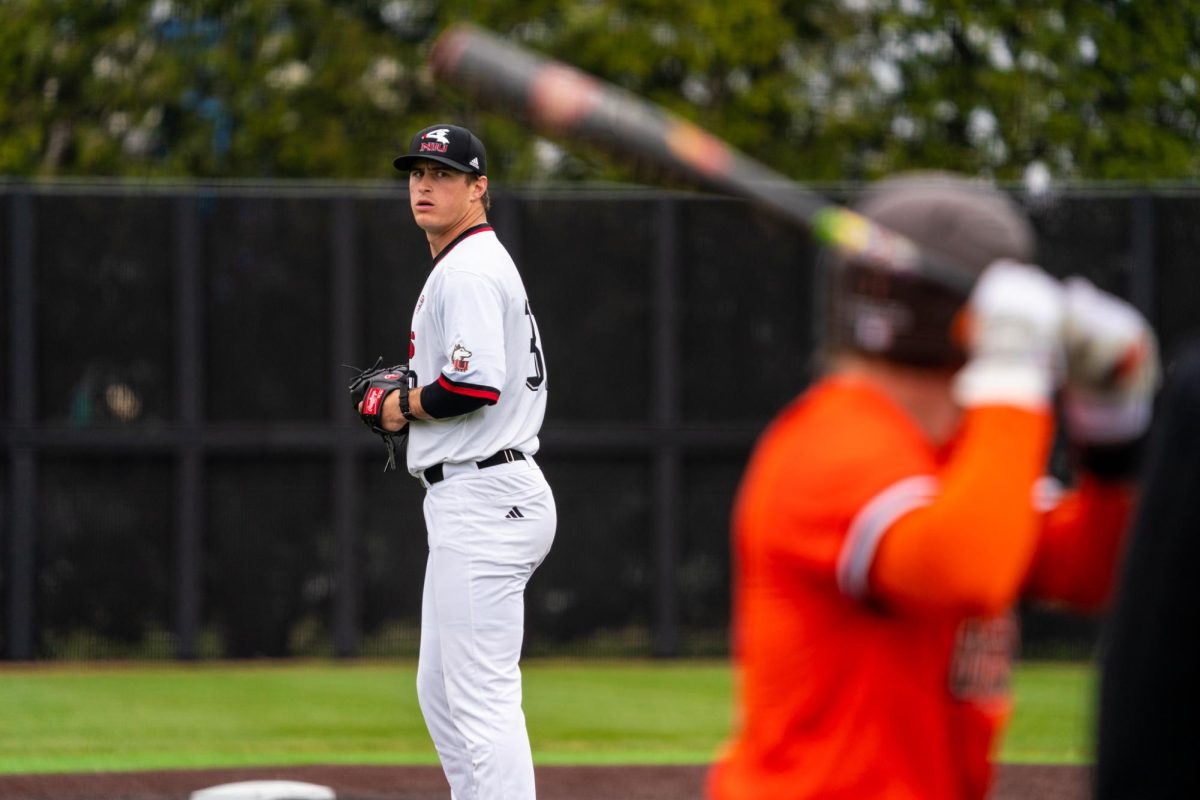 NIU baseball senior pitcher Matt Tarr stares down a Bowling Green State University batter to begin the ninth inning on Sunday at Ralph McKinzie Field and Walt Janice Owens Park. Tarr threw a scoreless ninth inning to help the Huskies secure their 16th win of the season. (Eric McGill | Northern Star)