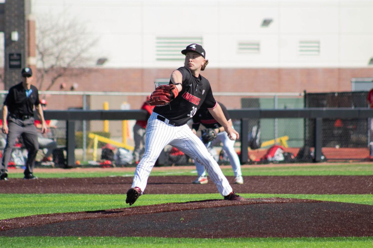 NIU baseball senior pitcher Max Vaisvila winds up for a pitch against Miami University on Saturday. Vaisvila pitched a complete game, allowing 1 run in the Huskies’ 5-1 win over the RedHawks. (Jayce Pendergrass | Northern Star)
