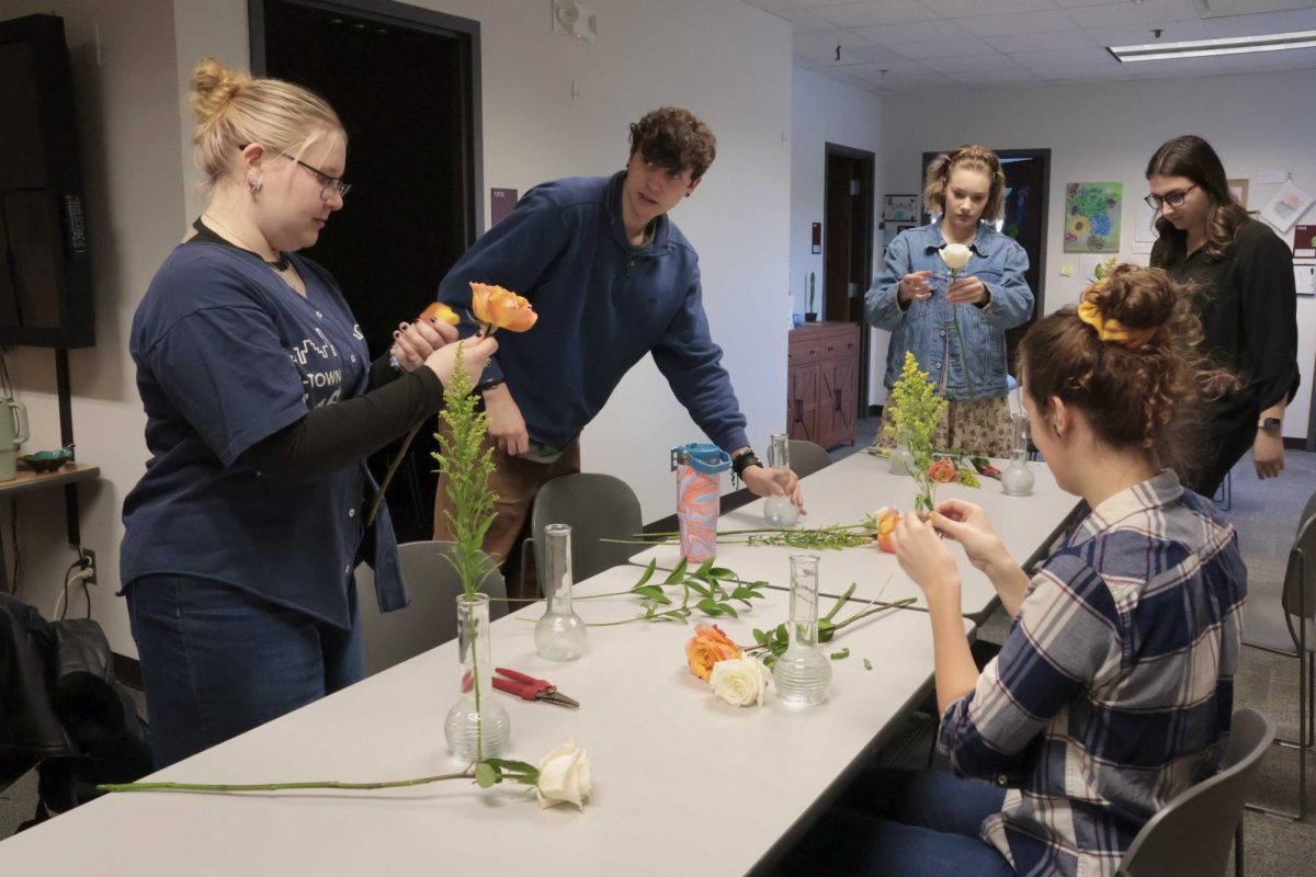 Students build bouquets and attend a panel with Willrett Flower Company co-founder Mary Grace McCauley on Wednesday in the Gender and Sexuality Resource Center. Willrett Flower Company is open 10 a.m. to 4 p.m. on Wednesdays and Thursdays. (Sofia Howell | Northern Star)