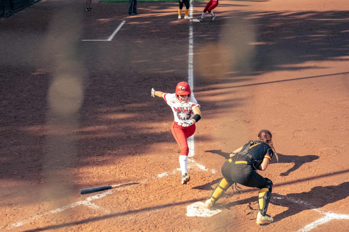 NIU softball freshman middle infielder/outfielder Mallory Wollenmann runs home during NIU’s game against Triton College on Sept. 12. The Huskies dropped an 8-1 game against Purdue University in the first game of the Boilermaker Softball Classic on Saturday.  (Totus Tuus Keely | Northern Star)