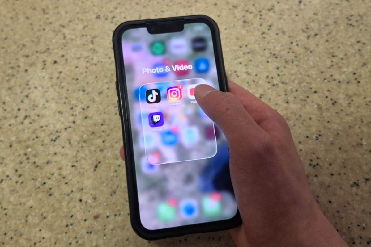Multiple social media apps are placed into a folder on an iPhone’s Home Screen. Assistant Lifestyle Editor Kahlil Kambui shares social media detox tips as well as the benefits of social media detoxing. (Sanaa Scott | Northern Star