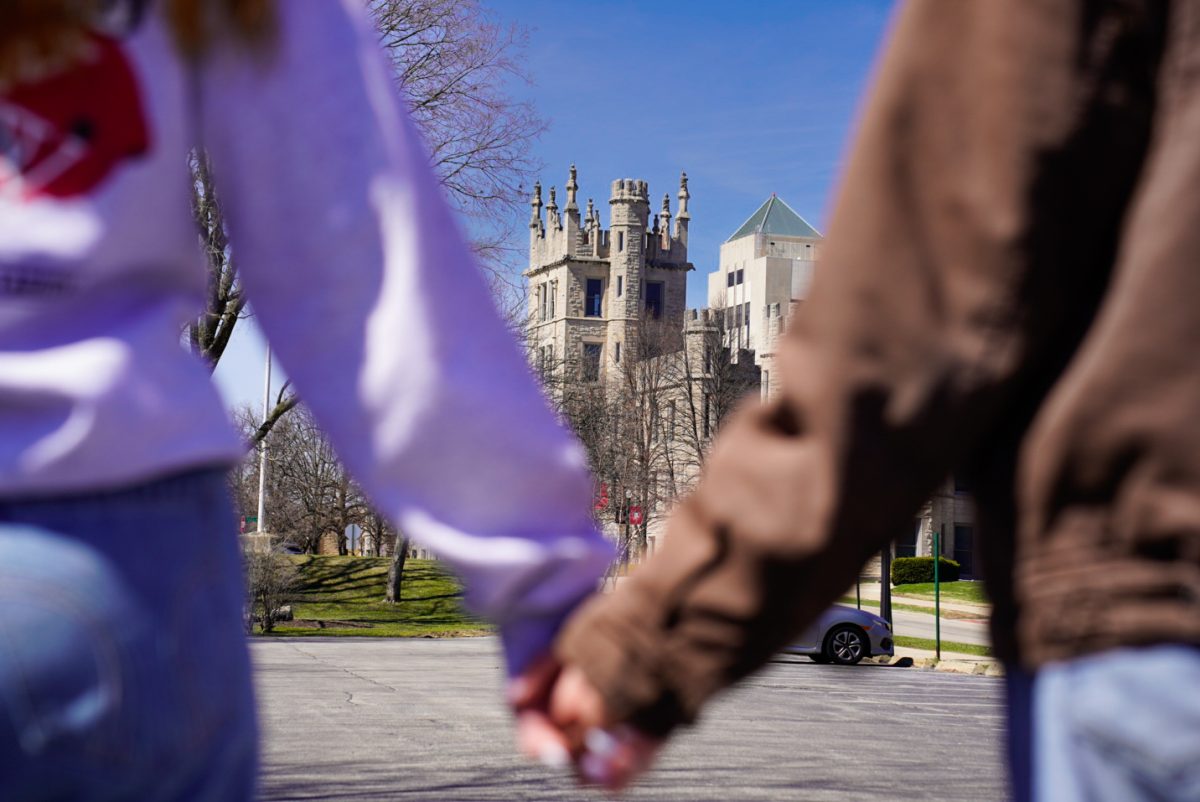 A couple walks hand in hand toward Altgeld Hall. Opinion Editor Gabe Santos believes you should consider factors other than your partner when choosing your college. (Ty McWilliams | Northern Star)