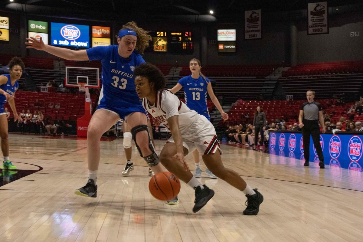 NIU women’s basketball freshman guard Cyra Conwell maintains control of the ball before attempting a layup against the University at Buffalo on Wednesday in the Convocation Center. NIU won its last home game of the season with a 56-53 victory over the Bulls. (Aidan Penca | Northern Star)