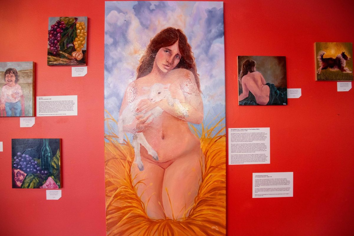 Various paintings from The Goddess Within exhibit are displayed on a wall on Wednesday at Jubilee Art Gallery, 128 E. Lincoln Highway. The exhibit can be visited from 11 a.m. to 5 p.m. Thursday through Saturday. (Roshay Grant | Northern Star)